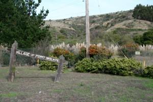 A collapsing sign welcomes motorists along Western Drive to the old Naval fuel depot and village of Point Molate. 