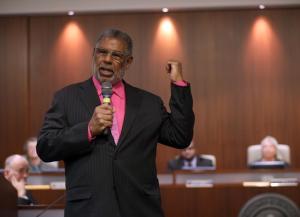 Outgoing Councilmember Corky Booze speaks during a swearing-in ceremony for new Mayor Tom Butt at the Richmond Memorial Auditorium and Convention Center in