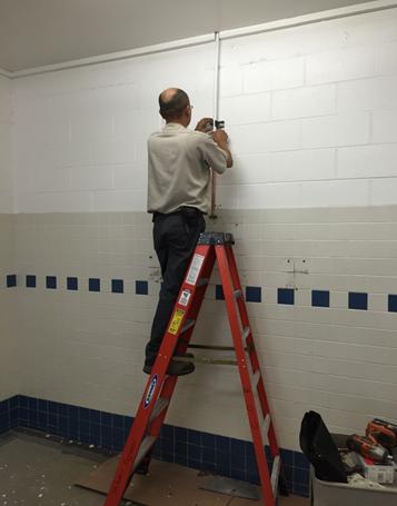 Description: Description: CARL REPLACING SHOWER VALVES AT SWIM CENTER