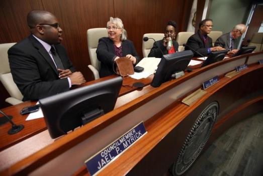 Incoming council member Jael P. Myrick, left, talks with outgoing Mayor Gayle McLaughlin during incoming Mayor Tom Butt's swearing-in ceremony at the Richmond Memorial Auditorium and Convention Centerl in Richmond, Calif., on Tuesday, Jan. 13, 2015. Lt. Gov. Gavin Newsom swore in Butt and several council members. McLaughlin will now serve on the council. (Jane Tyska/Bay Area News Group)