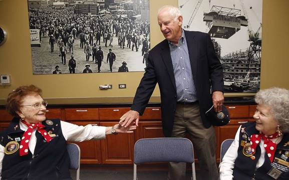 Richmond Mayor Tom Butt walks through the Rosie the Riveter/WWII Home Front National Historical Park Visitor Center next to the five acre controversial Richmond Riviera project in Richmond, California, on Friday, May 20, 2016.  He meets with Richmond Kaiser Shipyard #3 journeyman welder Agnes Moore (left), 1942-1945, and Richmond Kaiser Shipyard #3 electrician Priscilla Elder (right), 1943-1945. Developer is planning to build 59 luxury homes seeking support through a ballot measure.  Mayor Tom Butt would rather support ideas suited towards the historic past shipyard such as this museum. Photo: Liz Hafalia, The Chronicle