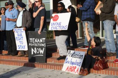 Richmond community members gathered for a press conference at Civic Center Plaza before Tuesday's special meeting to show their support for an urgency ordinance that would have implemented a 45-day ban on certain evictions and high rent increases. Photo by Abner Hauge.