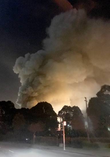 Smoke is seen coming from the Sims Metal Management property in this view from Cutting Boulevard as a scrap metal fire burns Richmond, Calif., on Tuesday, Jan. 30, 2018. Smoke was visible for miles and authorities warned residents to stay indoors. (Courtesy of Henna Papineau)