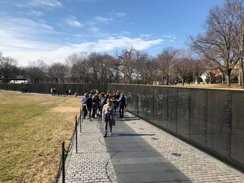 Image may contain: one or more people, people standing, sky, outdoor and nature
