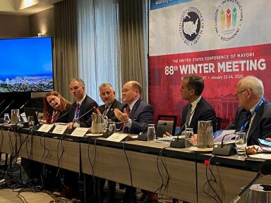 Image may contain: 5 people, people sitting and indoor