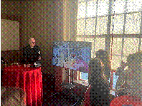 A person standing in front of a television  Description automatically generated with medium confidence,Figure 8 - Puppy corral