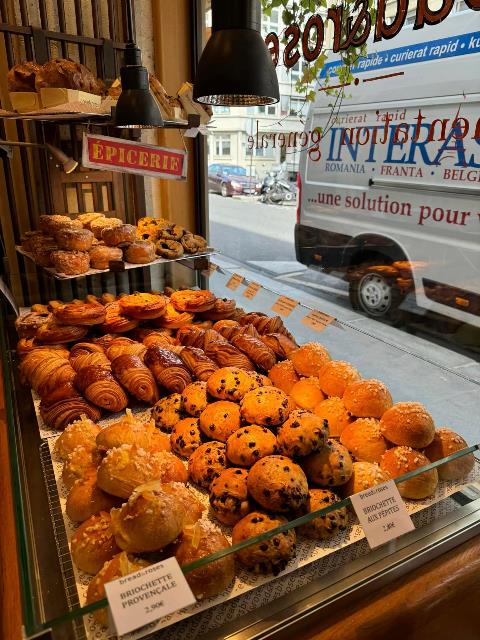 A display case with pastries and pastries Description automatically generated