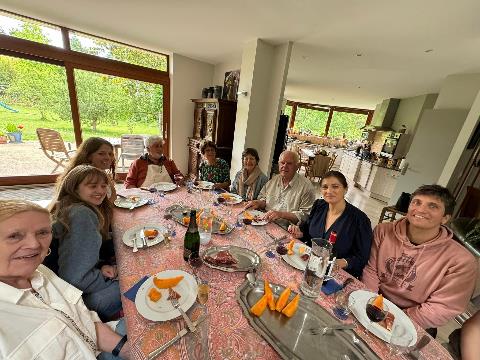 A group of people sitting at a table Description automatically generated