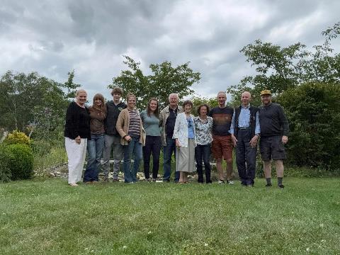 A group of people standing in a line Description automatically generated