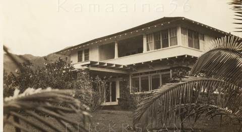 A house with trees in the background Description automatically generated